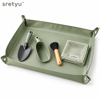sretyu sage-green foldable repotting mat with hand trowel, soil scoop, brush and leaf-care cloth on a white background