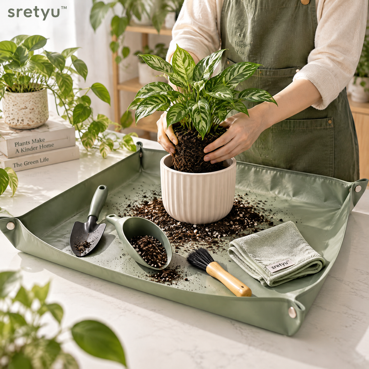 sretyu indoor repotting and plant care set used on a foldable sage-green work mat